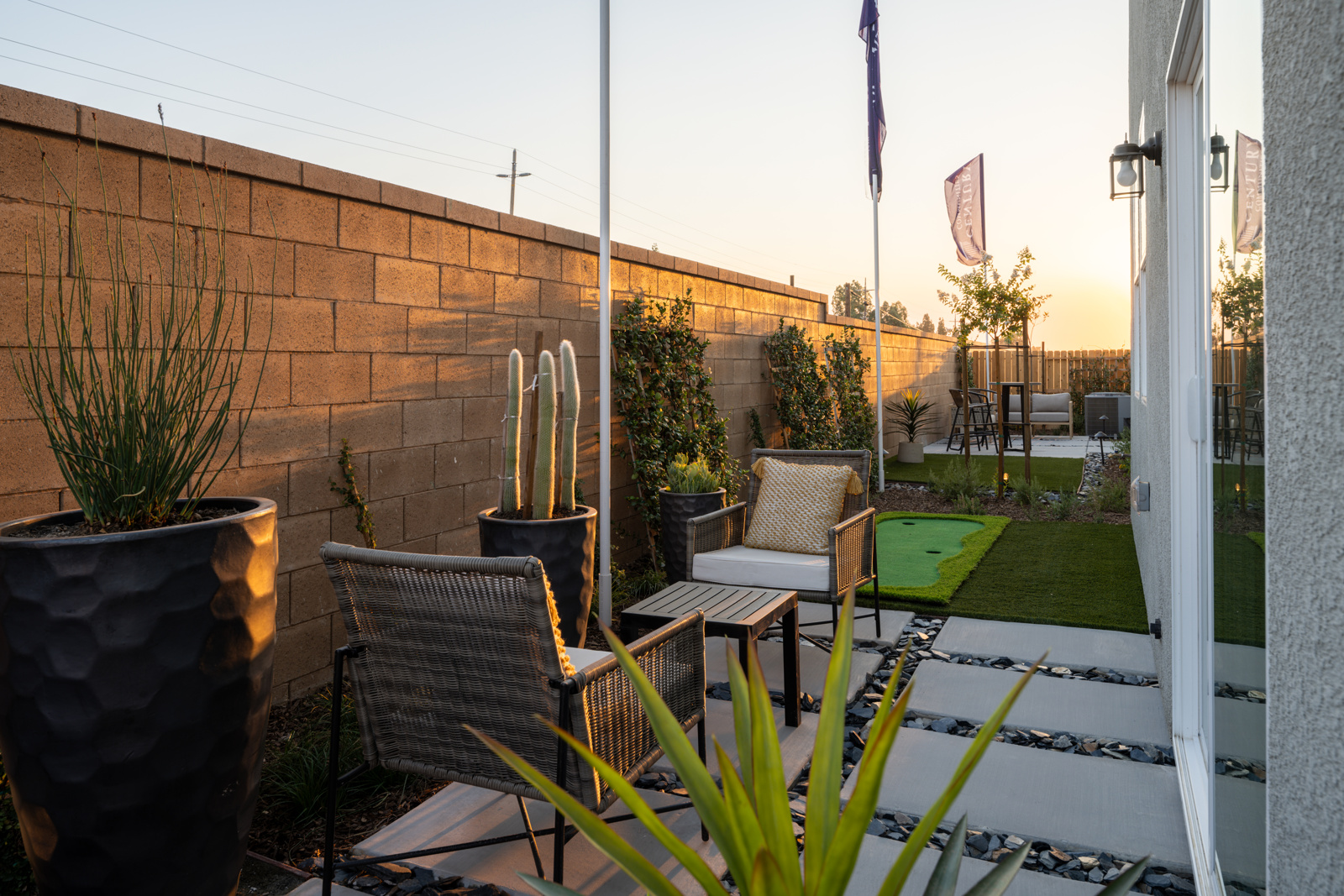 A patio with a table and chairs.