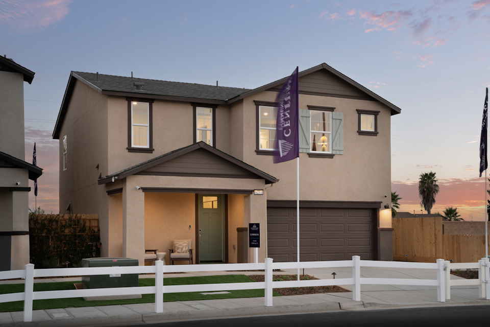 A house with a white picket fence.