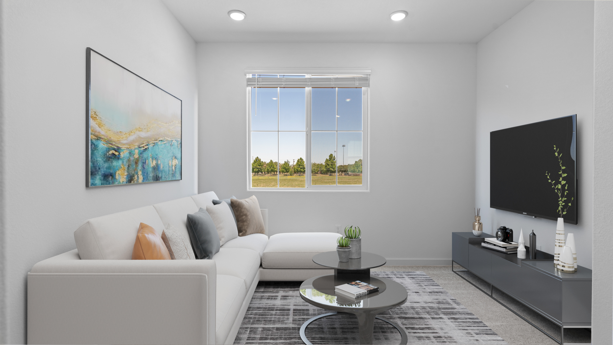 A living room with a white couch and a coffee table.