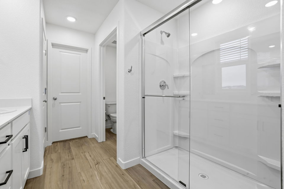 A bathroom with a glass shower.