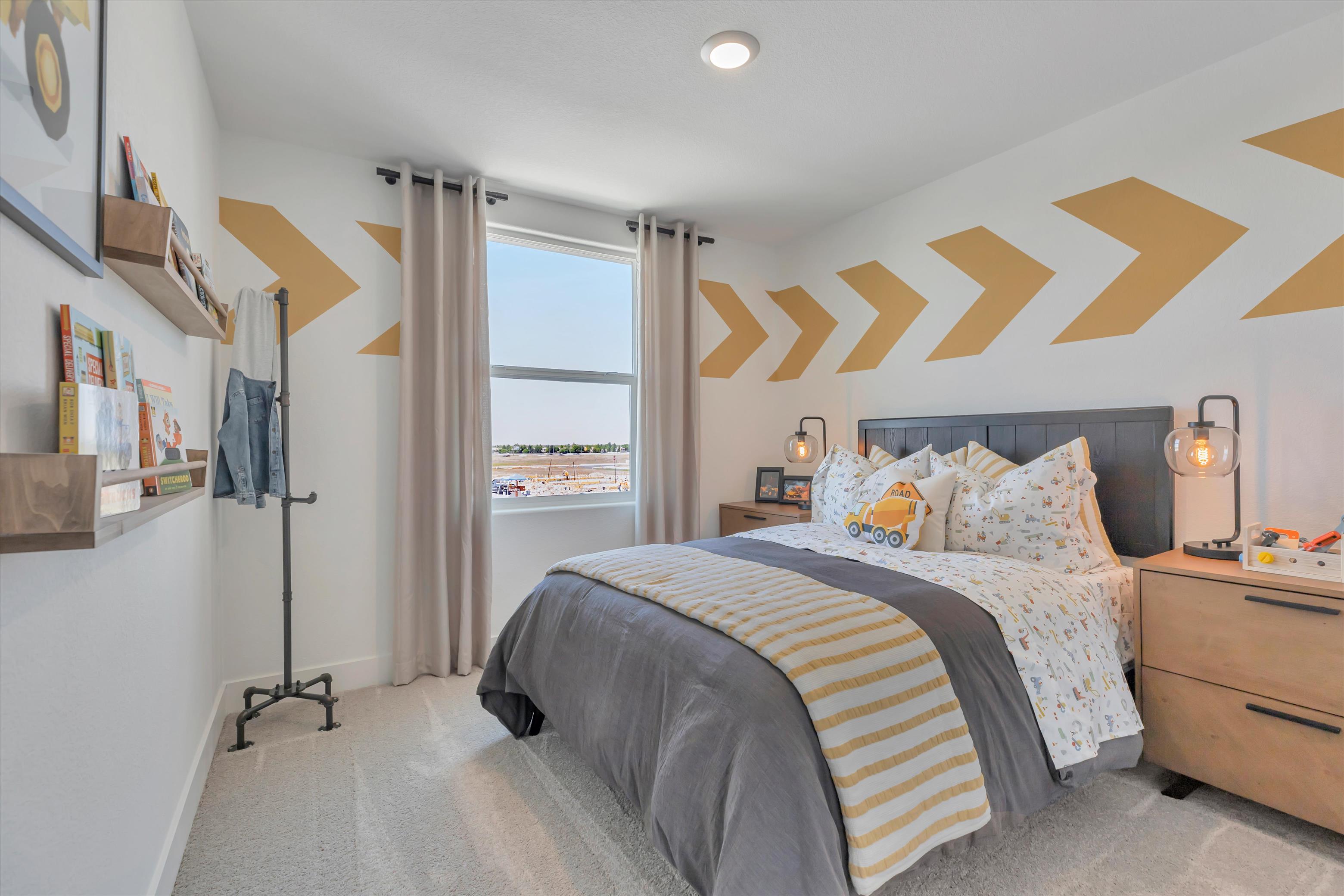 A bedroom with a bed and a window.