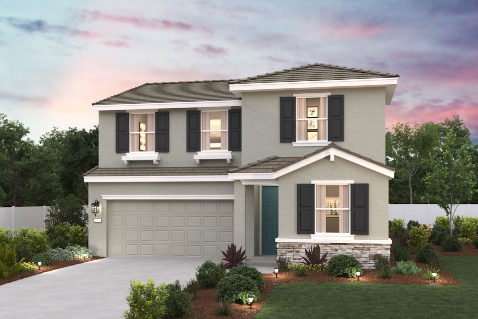 A white house with a garage.