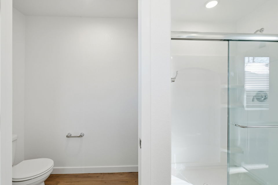 A bathroom with a shower unit.