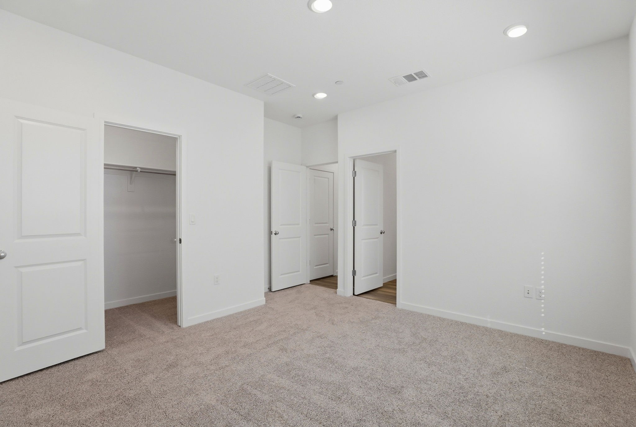 A room with white doors.