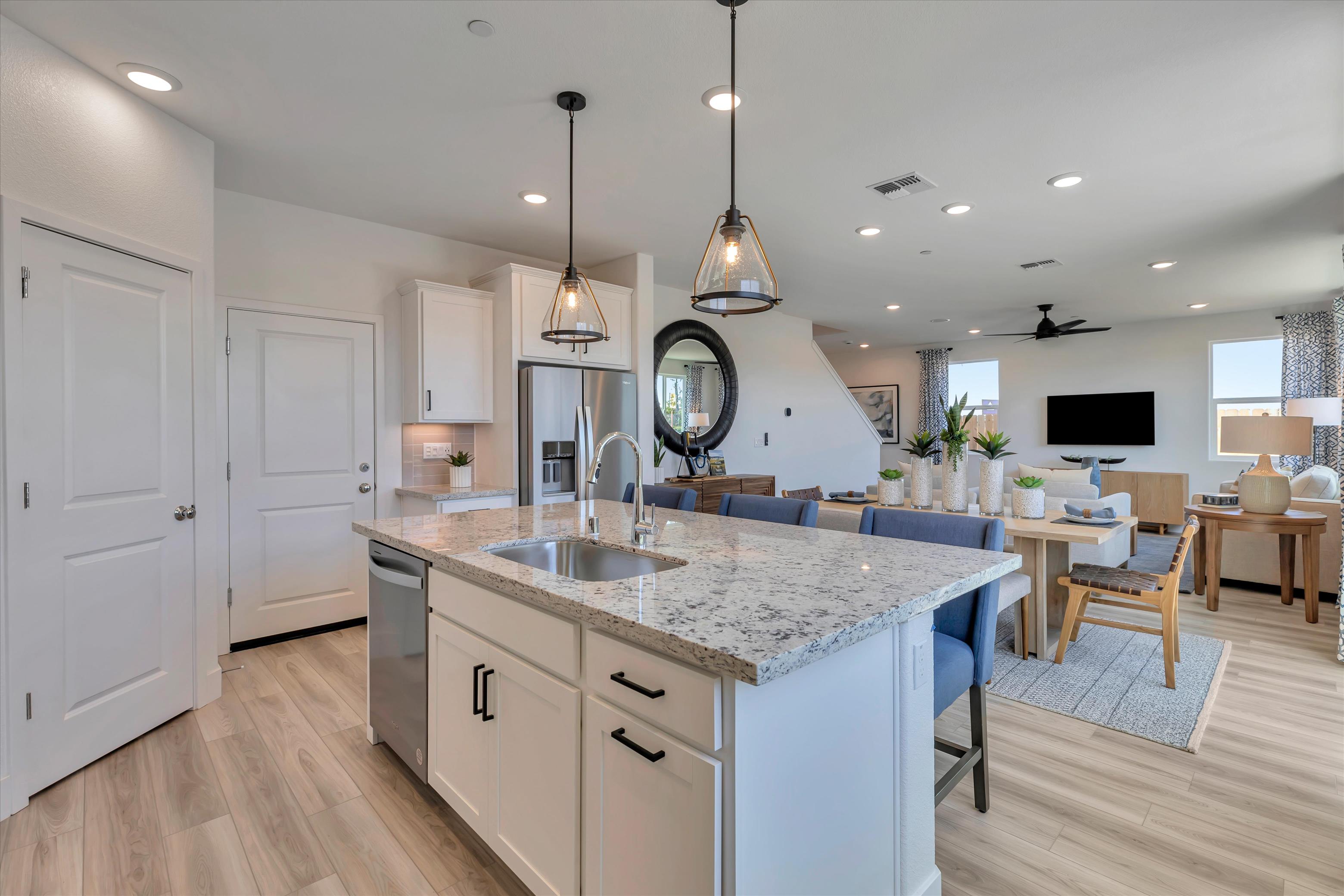 A kitchen with a marble island.