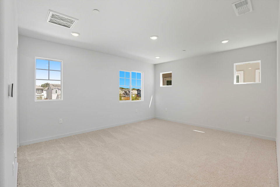 A room with a few paintings on the wall.