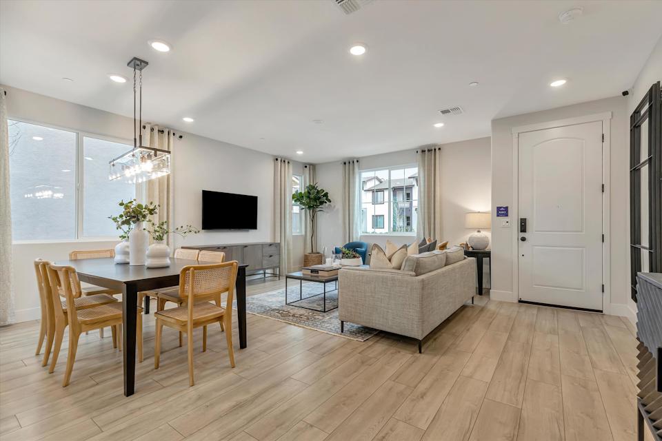 A living room with a wood floor.