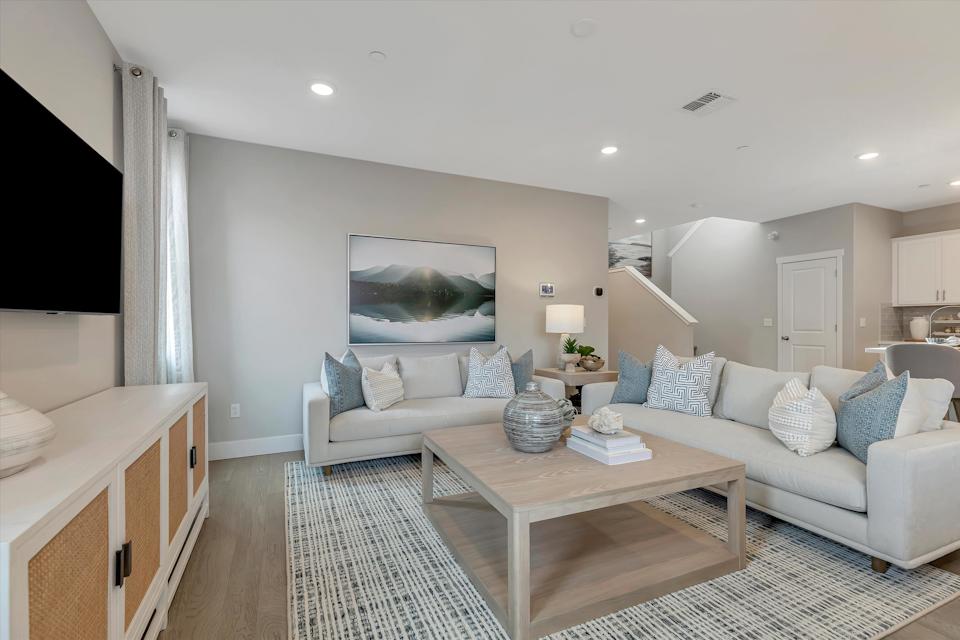 A living room with a couch and a coffee table.