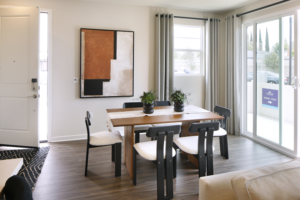 A room with a table and chairs.