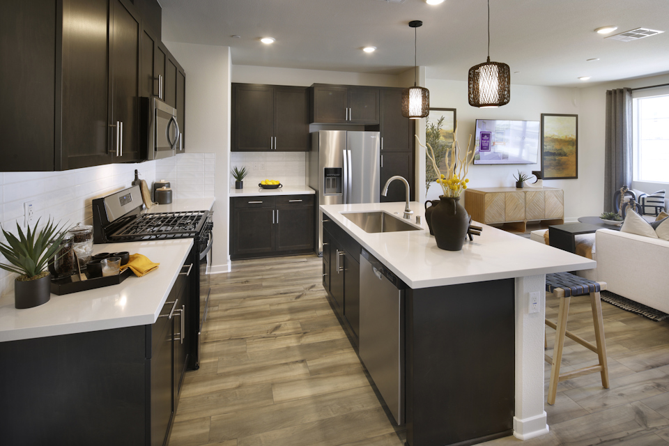 A kitchen with black appliances.