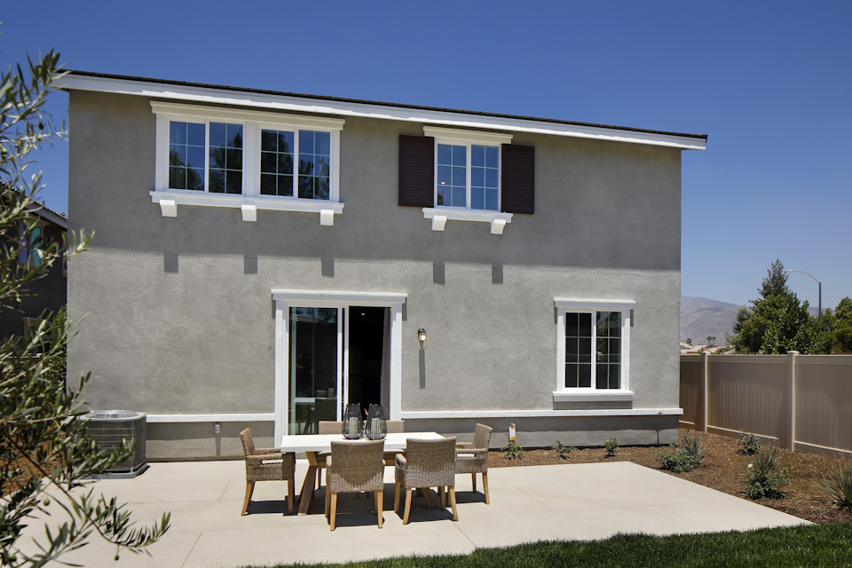 A house with a patio and tables.