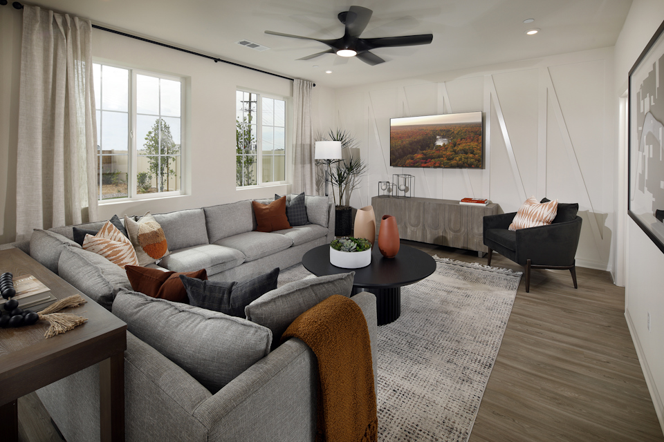 A living room with a couch and a table.