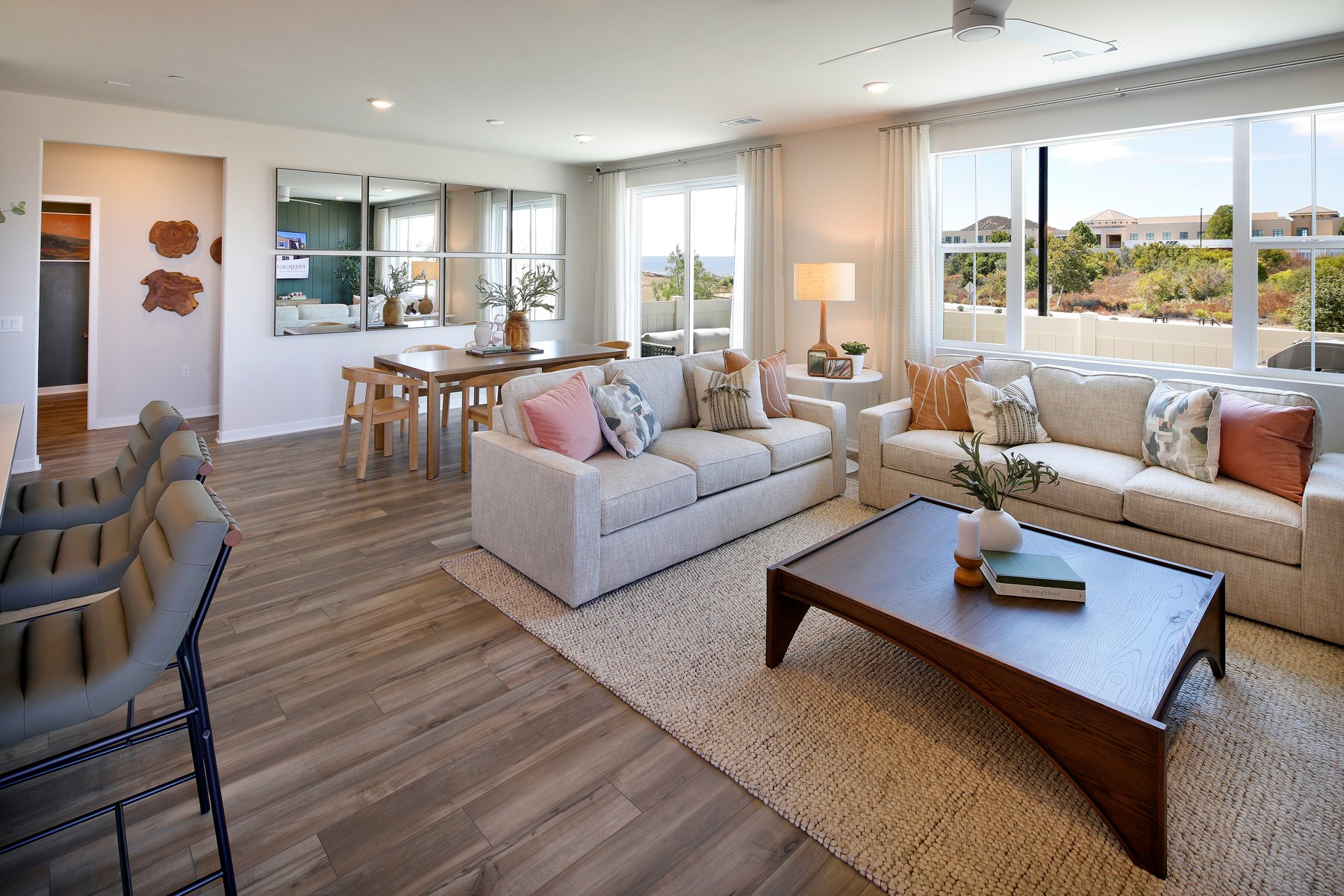 A living room with a wood floor.