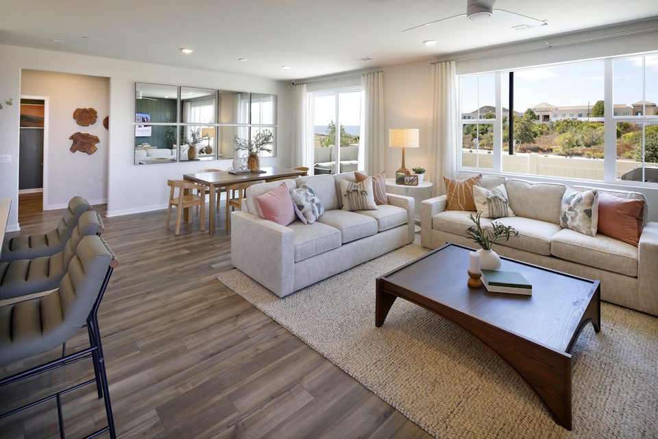 A living room with a wood floor.