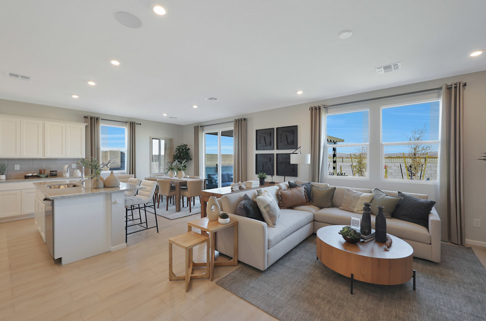 A large living room with a large window.