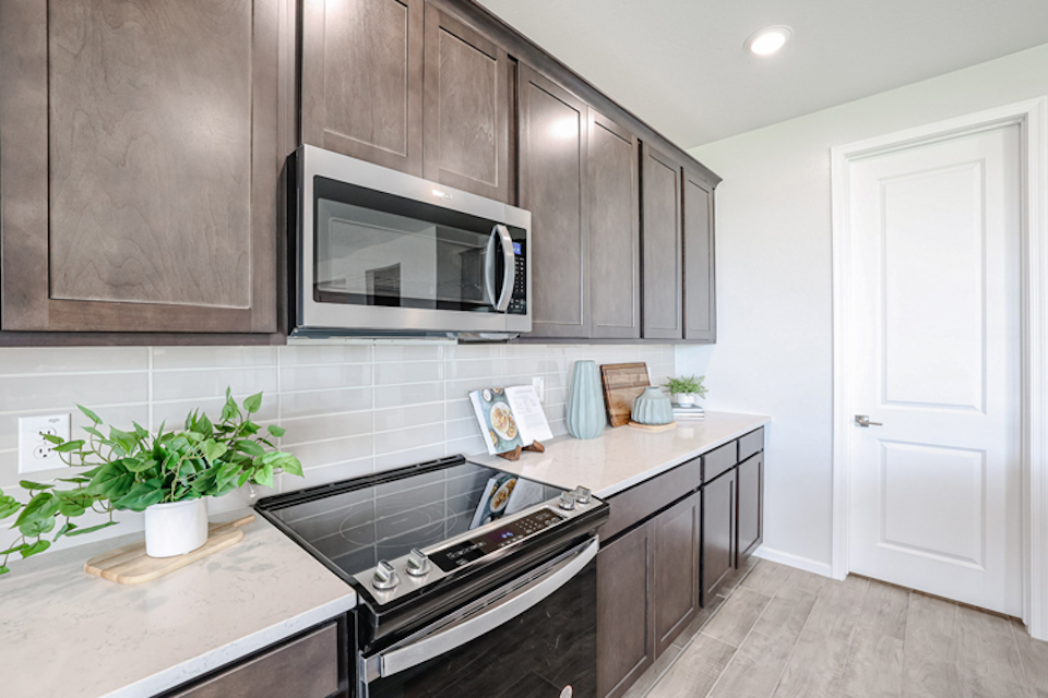 A kitchen with black appliances.