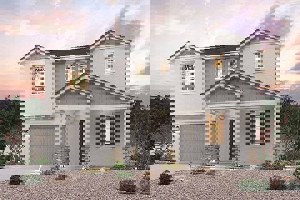 A white house with a garage.