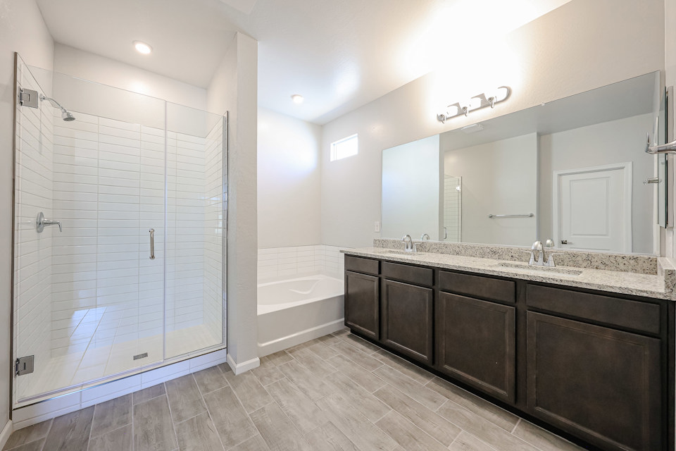 A bathroom with a large glass shower.