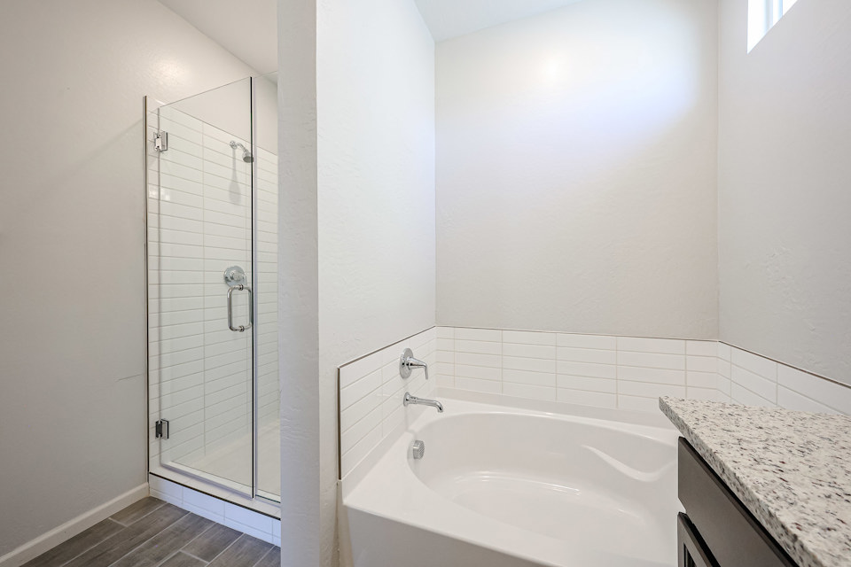 A bathroom with a glass shower.