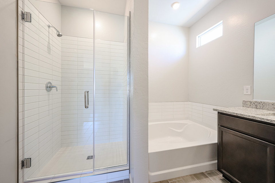 A bathroom with a glass shower.
