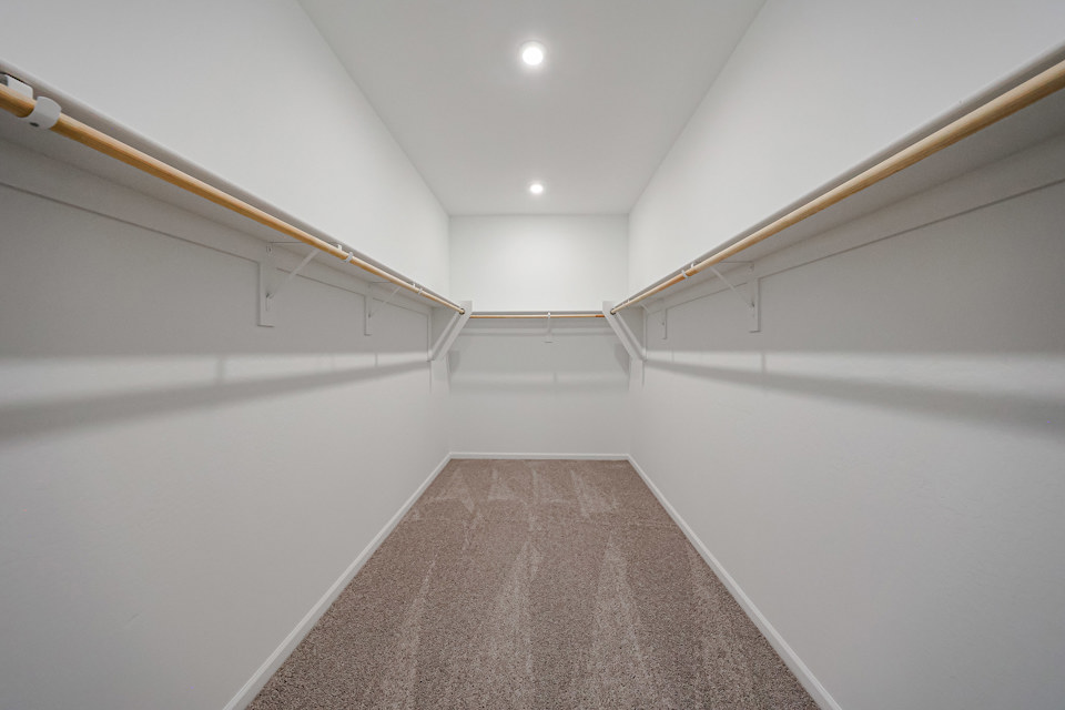 A hallway with white walls.