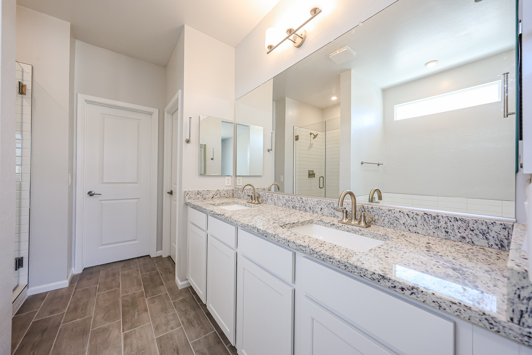 A bathroom with a marble countertop.