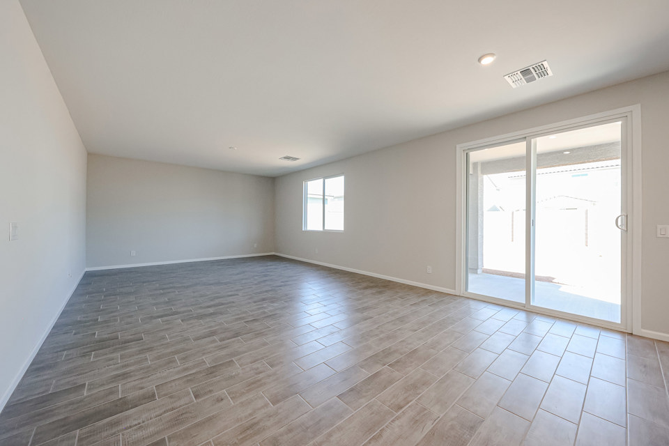 A room with a wood floor and a wood floor.