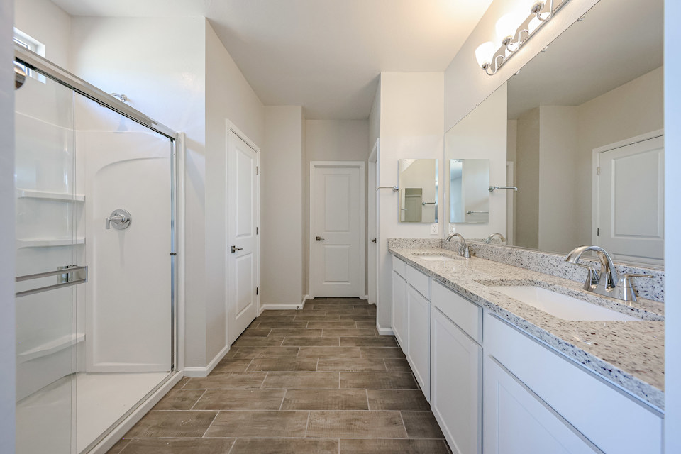 A bathroom with a glass shower.