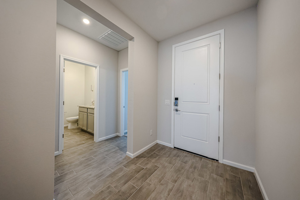 A bathroom with white doors.