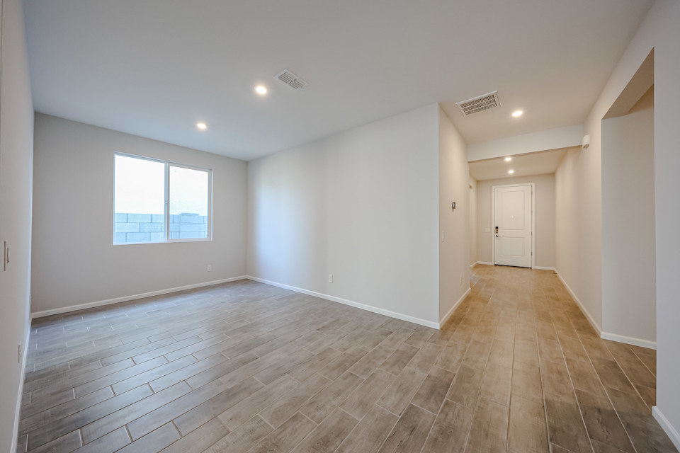 A room with a wood floor and a wood floor.
