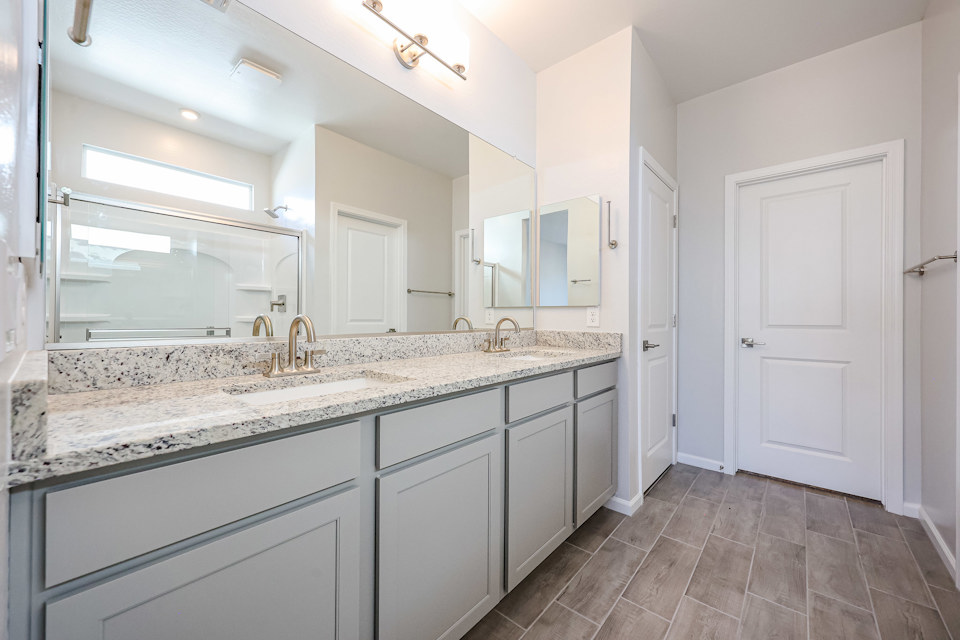 A bathroom with a marble countertop.