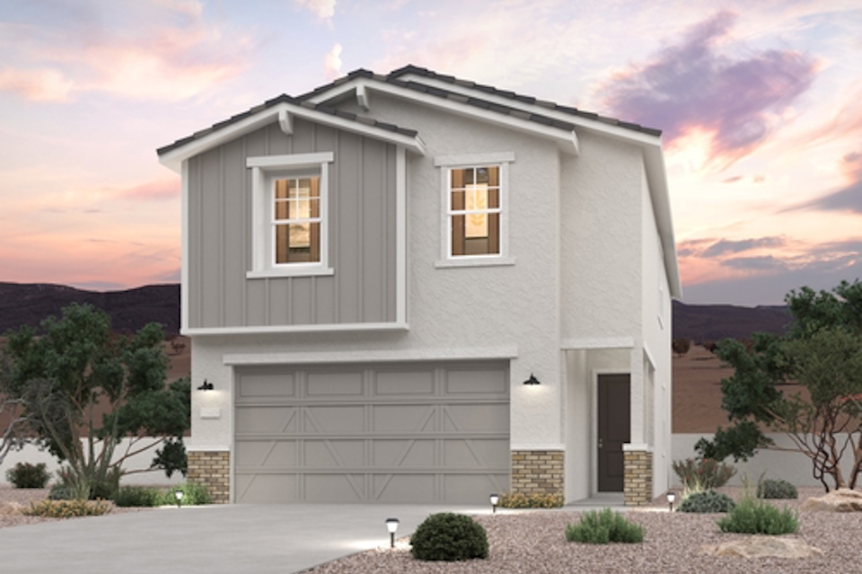 A white house with a garage.