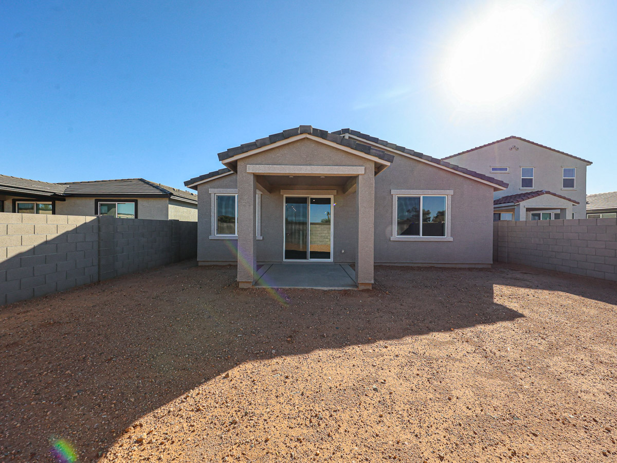A building with a dirt yard.