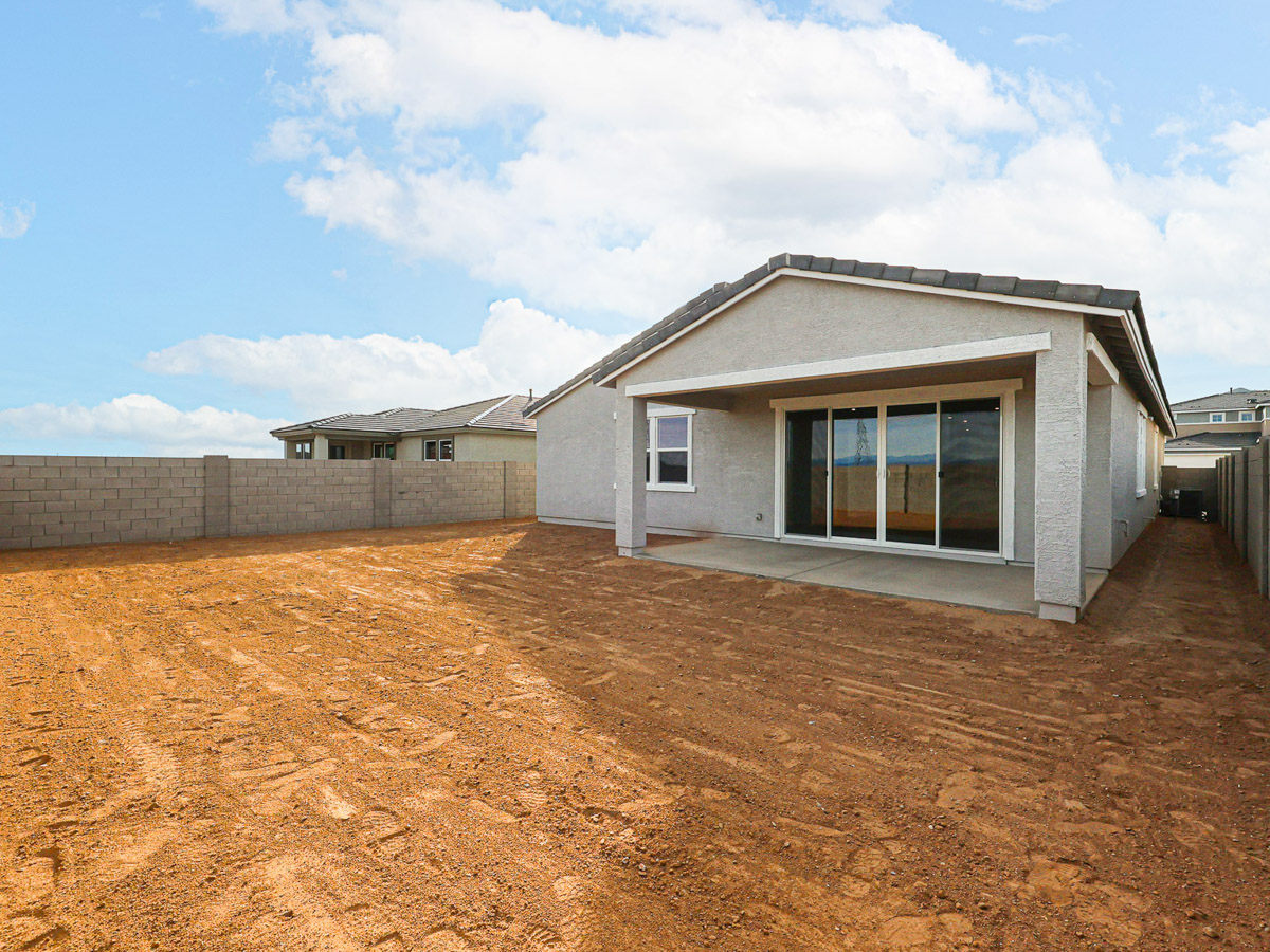 A house in a dirt field.