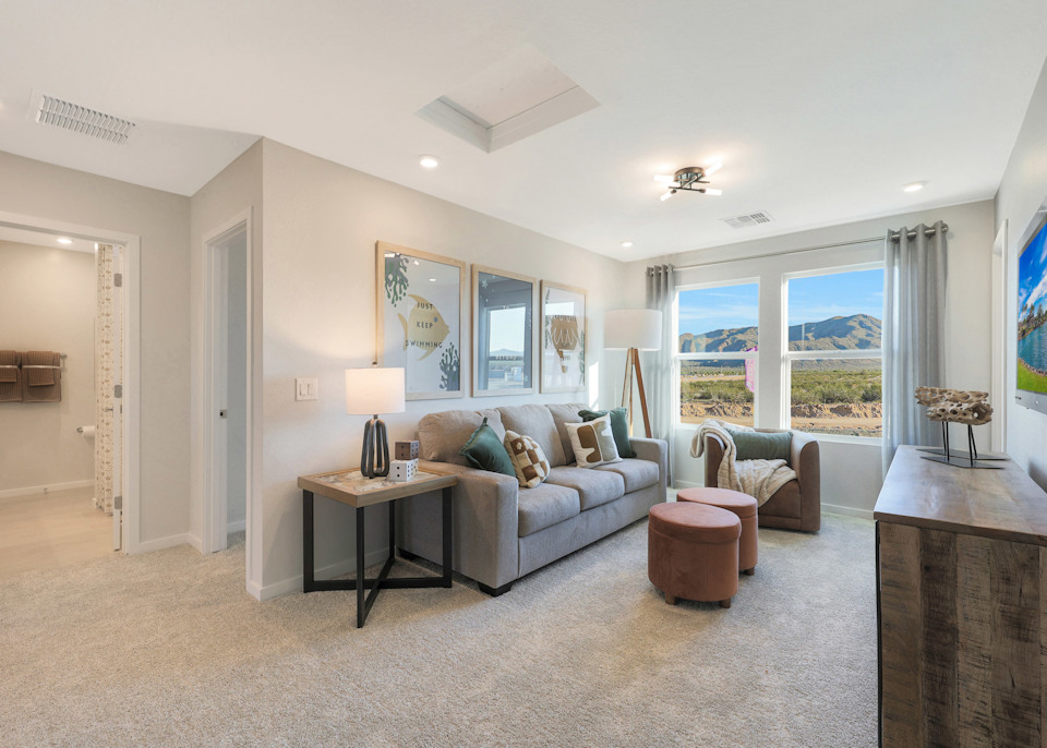 A living room with a large window.