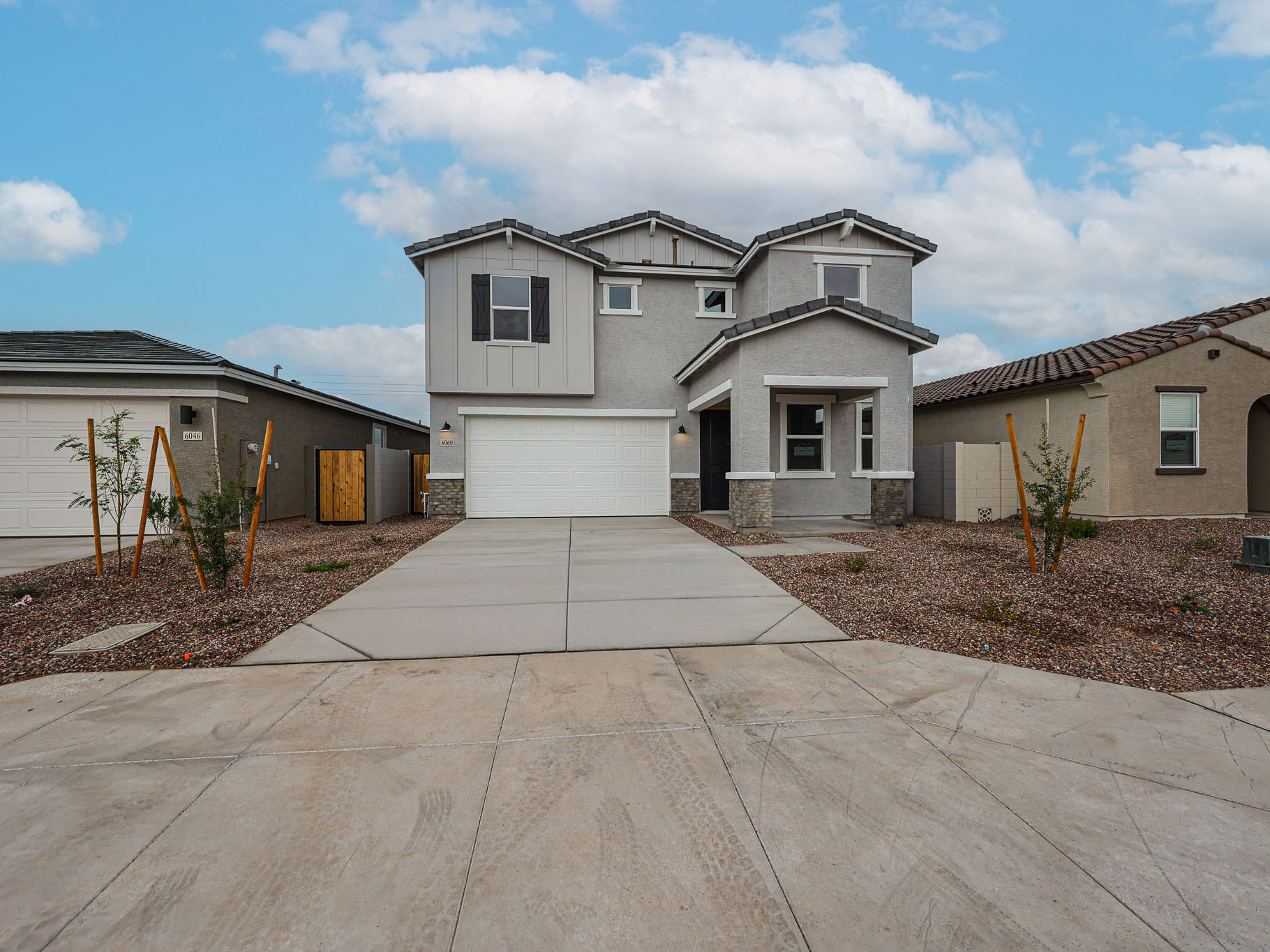 A driveway leading to a house.