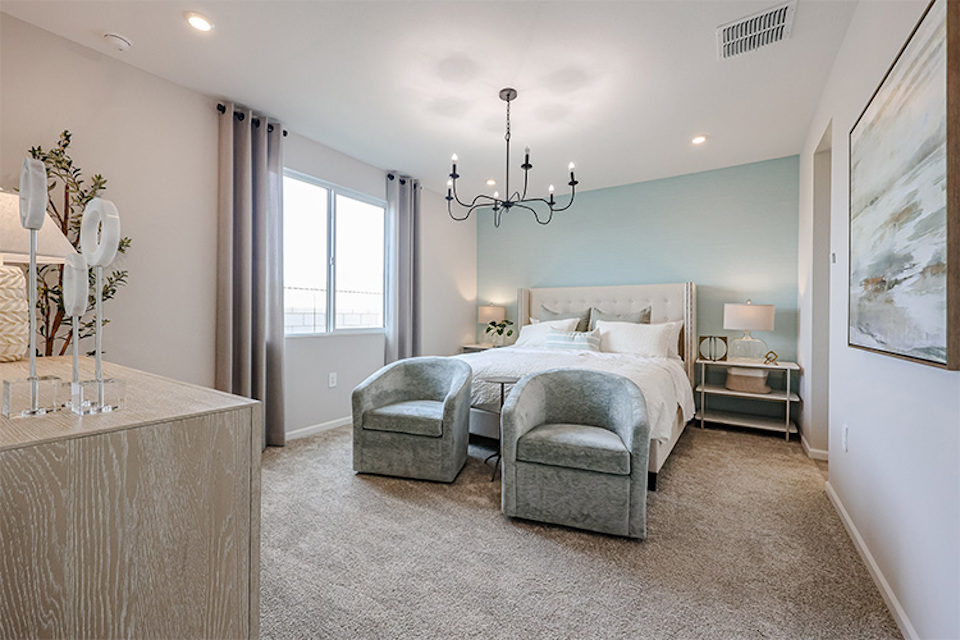 A bedroom with a bed and a couch.