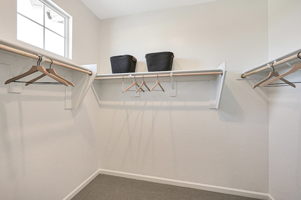 A room with a chair and a table.