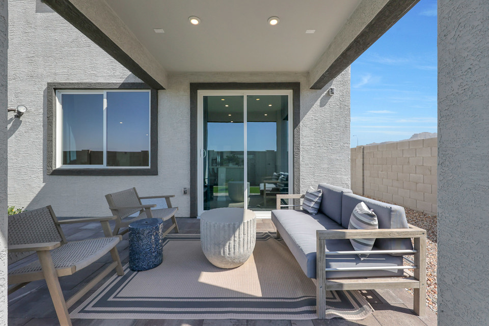 A living room with a couch and chairs.