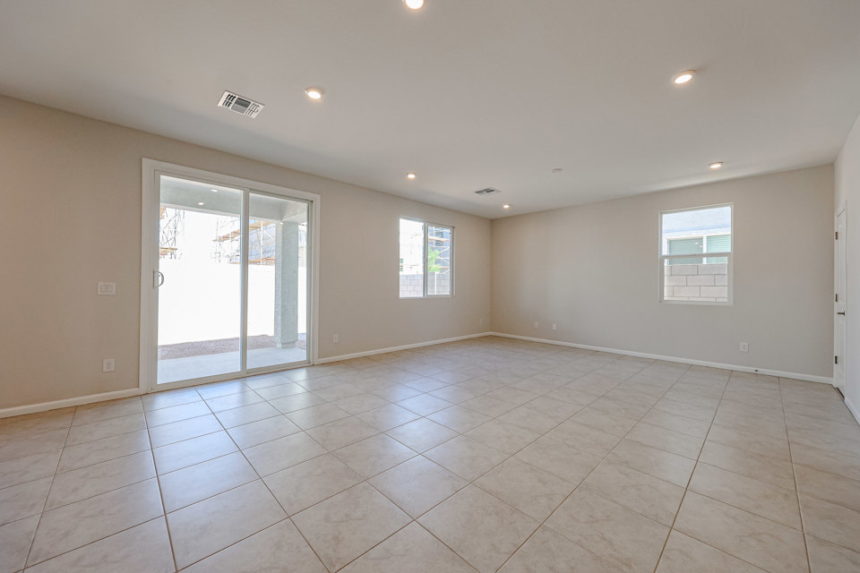 A room with a tile floor and windows.