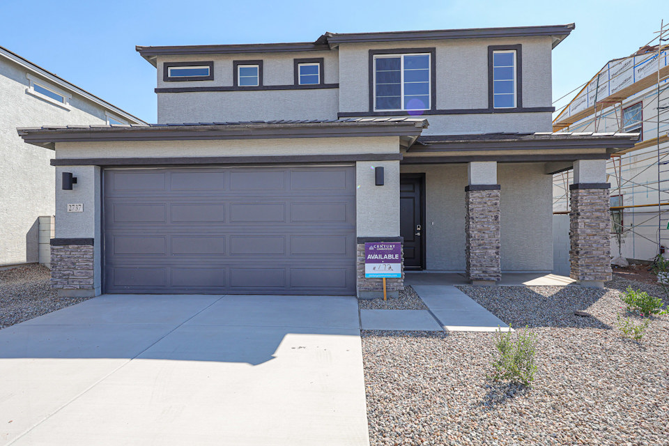 A building with a sign in front.