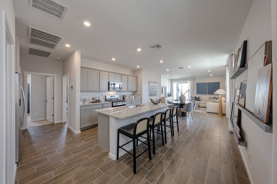 A kitchen with a dining table.