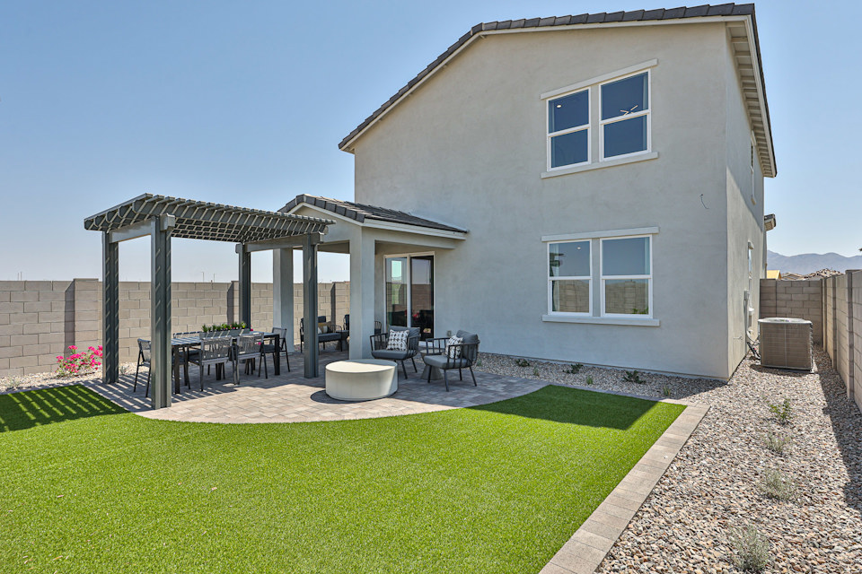 A house with a patio and tables.