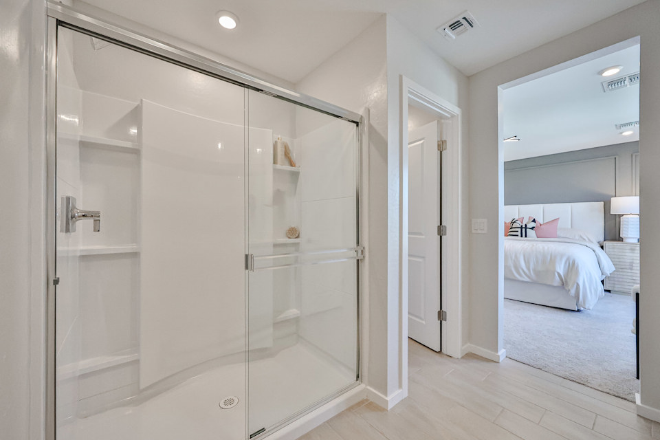 A bathroom with a glass shower.