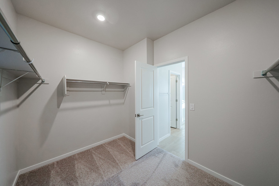 A hallway with white doors.