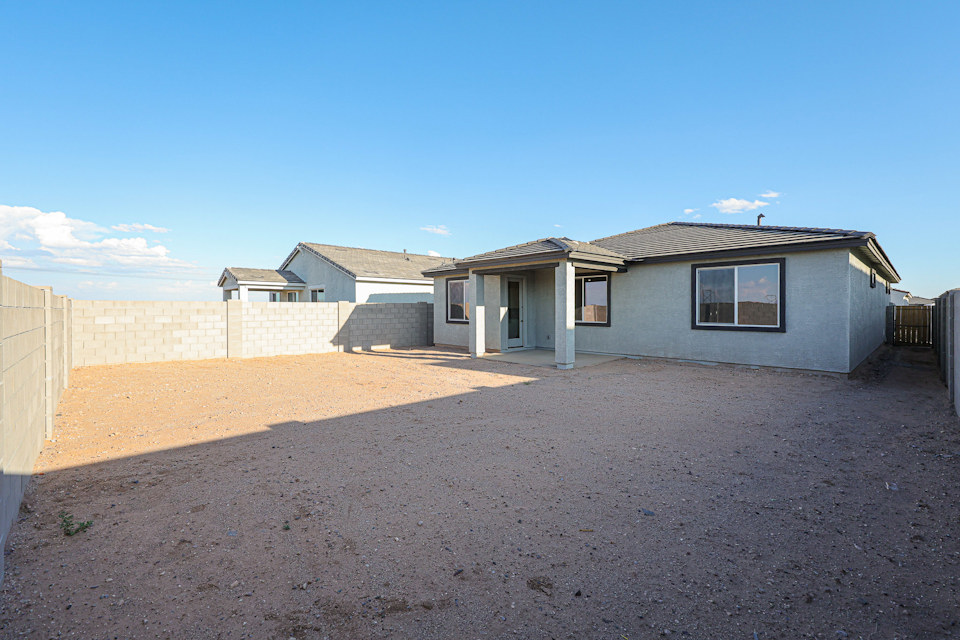 A house with a dirt yard.
