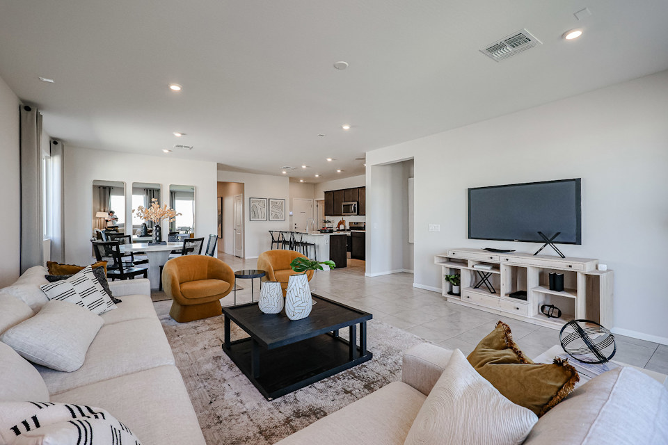 A living room with a tv and couches.
