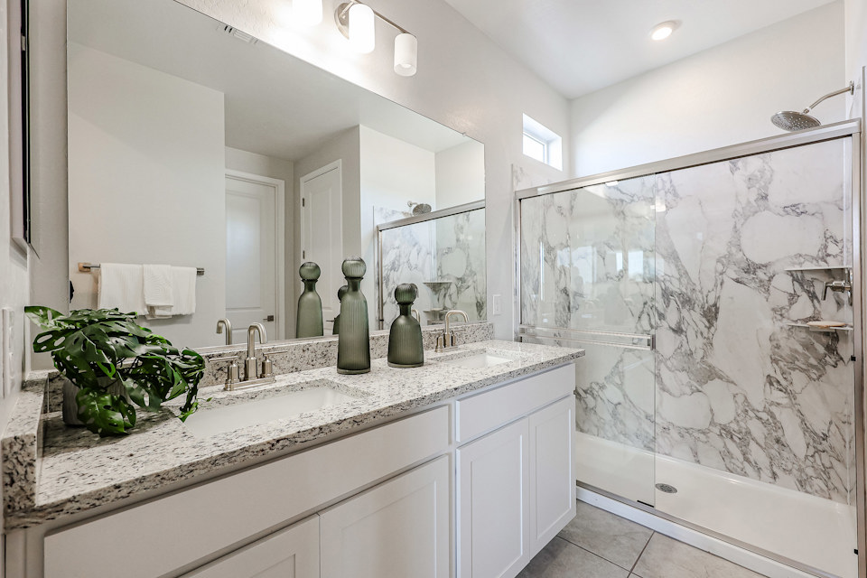 A bathroom with a marble countertop.