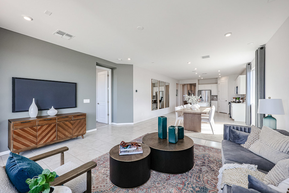 A living room with a large television.