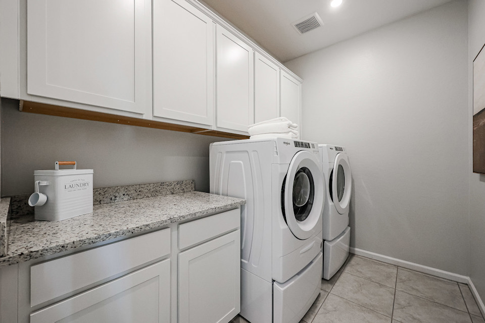 A washing machine in a kitchen.